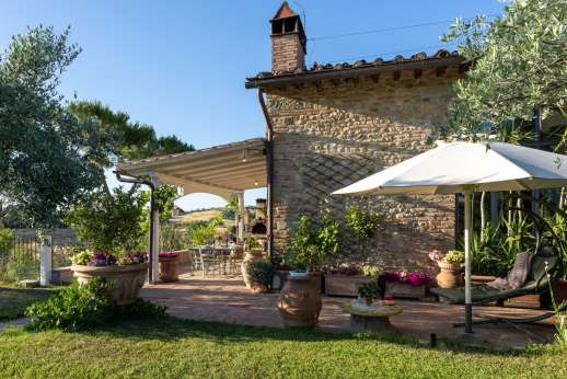 Colli Fiorentini - A Loggia furnished for lounging and dining.
