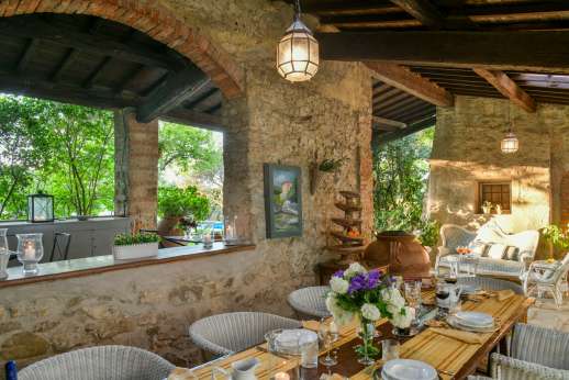 Villa San Martin - Dining area looking though to seating in the loggia and the pool