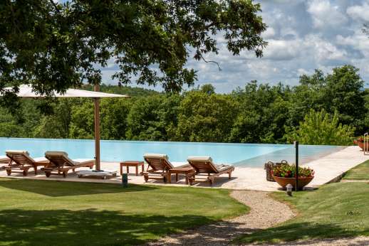 Dadianora - The lemon house lies across the lawn, nestled in the centre of the garden
