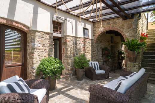 Villa Albizi - Relaxing outside seating area with paved area by the pool in the background