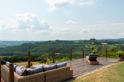 San Leolino - The medieval city of San Gimignano with its towers sits as a back drop to the large infinity-edge swimming pool.