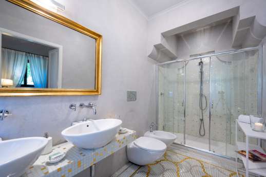 Villa Di Masseto - En suite bathroom with two sinks.