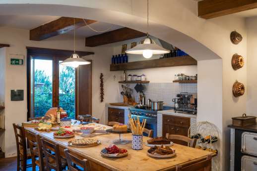 Il Cortile Pratolino (x 15 people) with Staff and Cook - Well-equipped kitchen with a dining table for 15