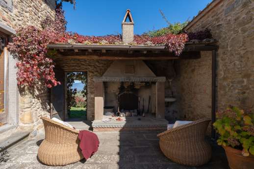 Il Cortile Pratolino (x 15 people) with Staff and Cook - In the courtyard there is a wonderful little nook provides an outdoor sitting area in front of a big stone fireplace