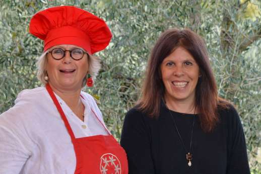 Hosts welcoming guests for an organic wine tasting and Tuscan food experience at Villa Santa Dieci near Siena