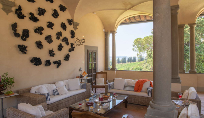 Villa Tinaccio At one end of the loggia is a modern sitting area positioned around a centrepiece of wall-mounted sculptures