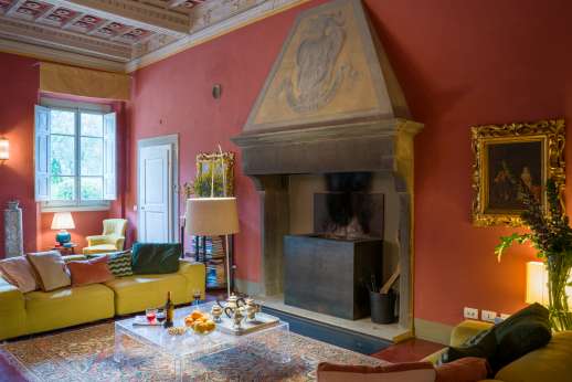 Villa Caprolo - The large living room with a fireplace. Geo thermal heating and air conditioning throughout the property.
