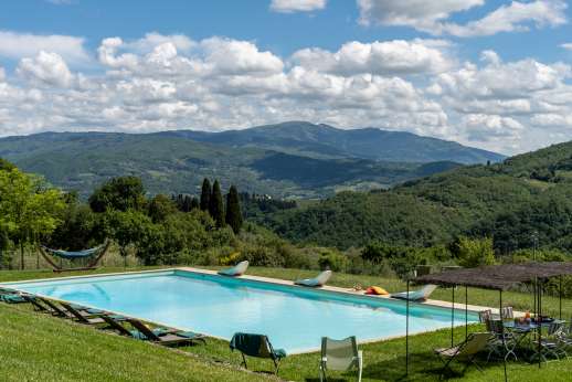 The Estate of Petroio with Staff and Cook - The very large, fenced swimming pool, 8 x 18m/26 x 58 feet, is set on a lawned terrace enjoying sun all day and stunning views.